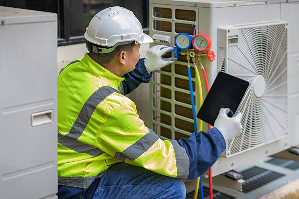 Professional Heat Pump Repair technician working in Fall River, MA